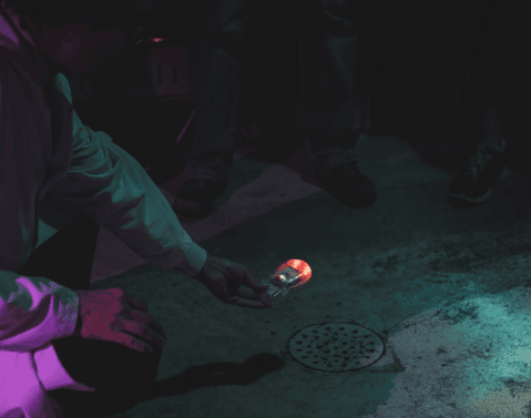 Paranormal expert using ghost haunting tool to measure paranormal activity